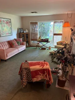 a bedroom with bed and window