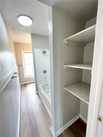 a view of entryway with wooden floor