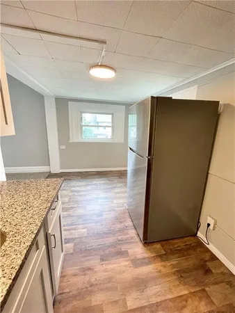 a view of a kitchen from the hallway