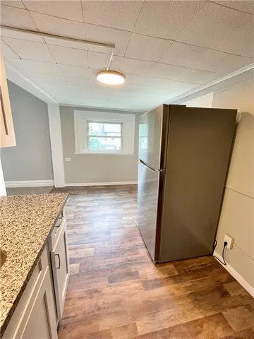 a view of a kitchen from the hallway