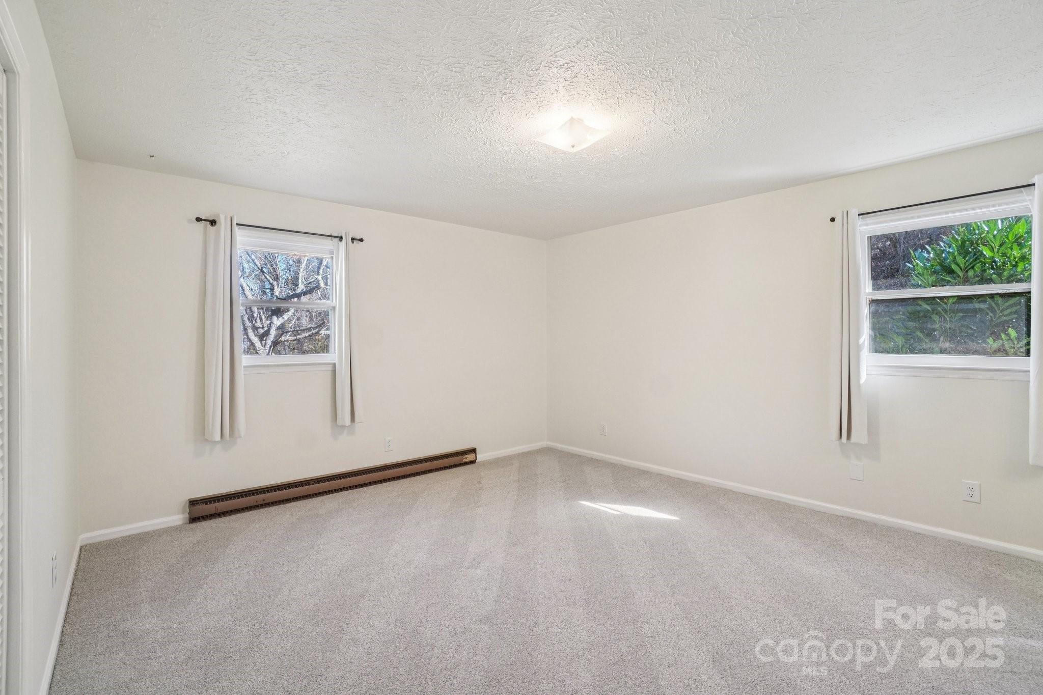 480 Paint Fork Road Barnardsville, NC 28709 - Photo 14 of 43 an empty room with a window