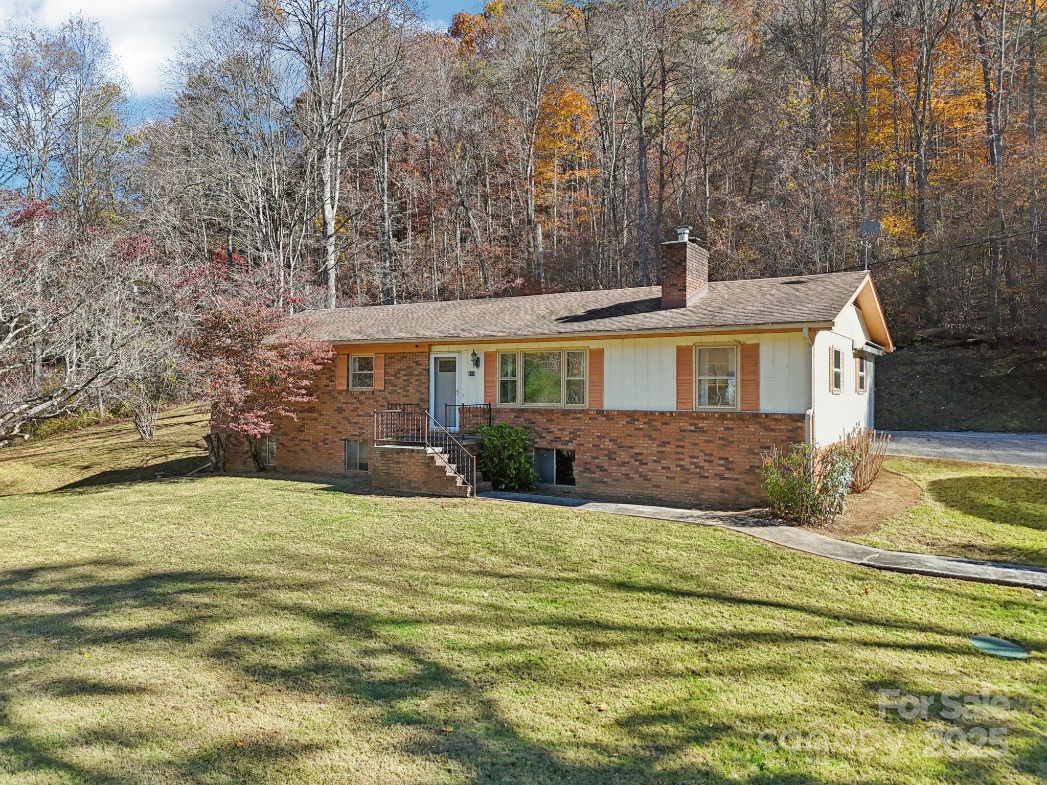 480 Paint Fork Road Barnardsville, NC 28709 - Photo 2 of 43 a view of a house with a swimming pool