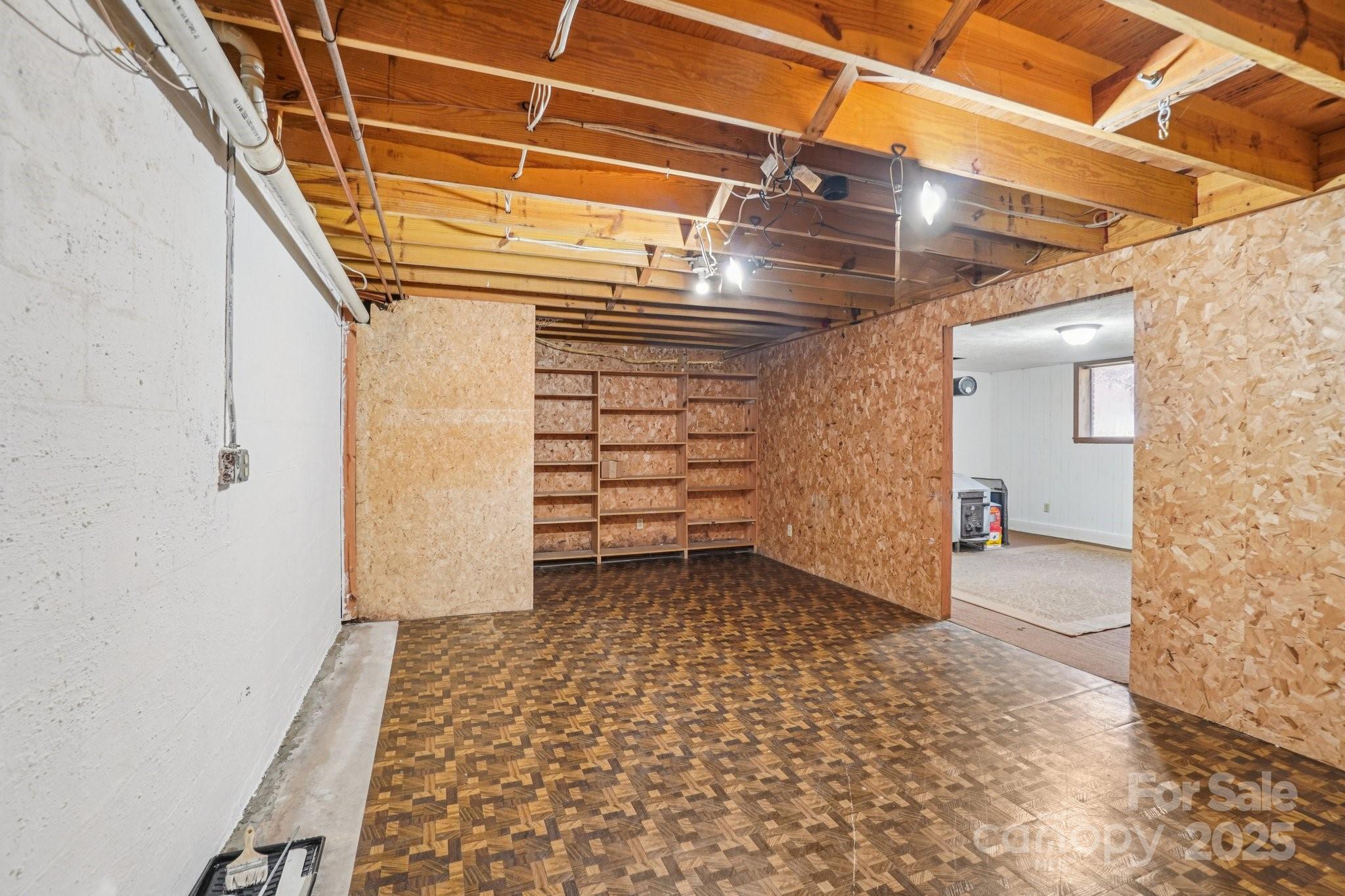 480 Paint Fork Road Barnardsville, NC 28709 - Photo 31 of 43 a view of a room with wooden walls and stairs
