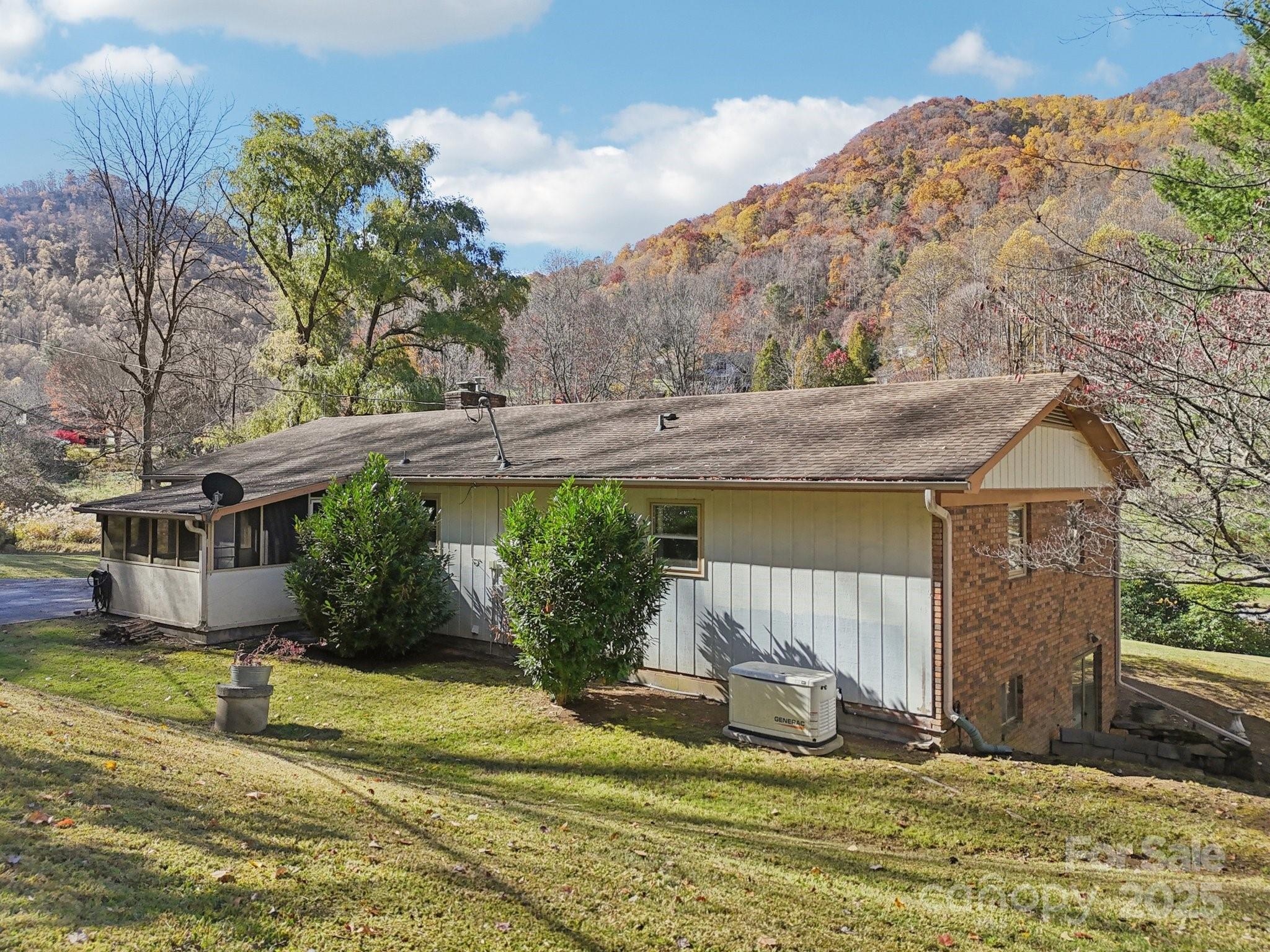 480 Paint Fork Road Barnardsville, NC 28709 - Photo 35 of 43 a view of a house with backyard and sitting area