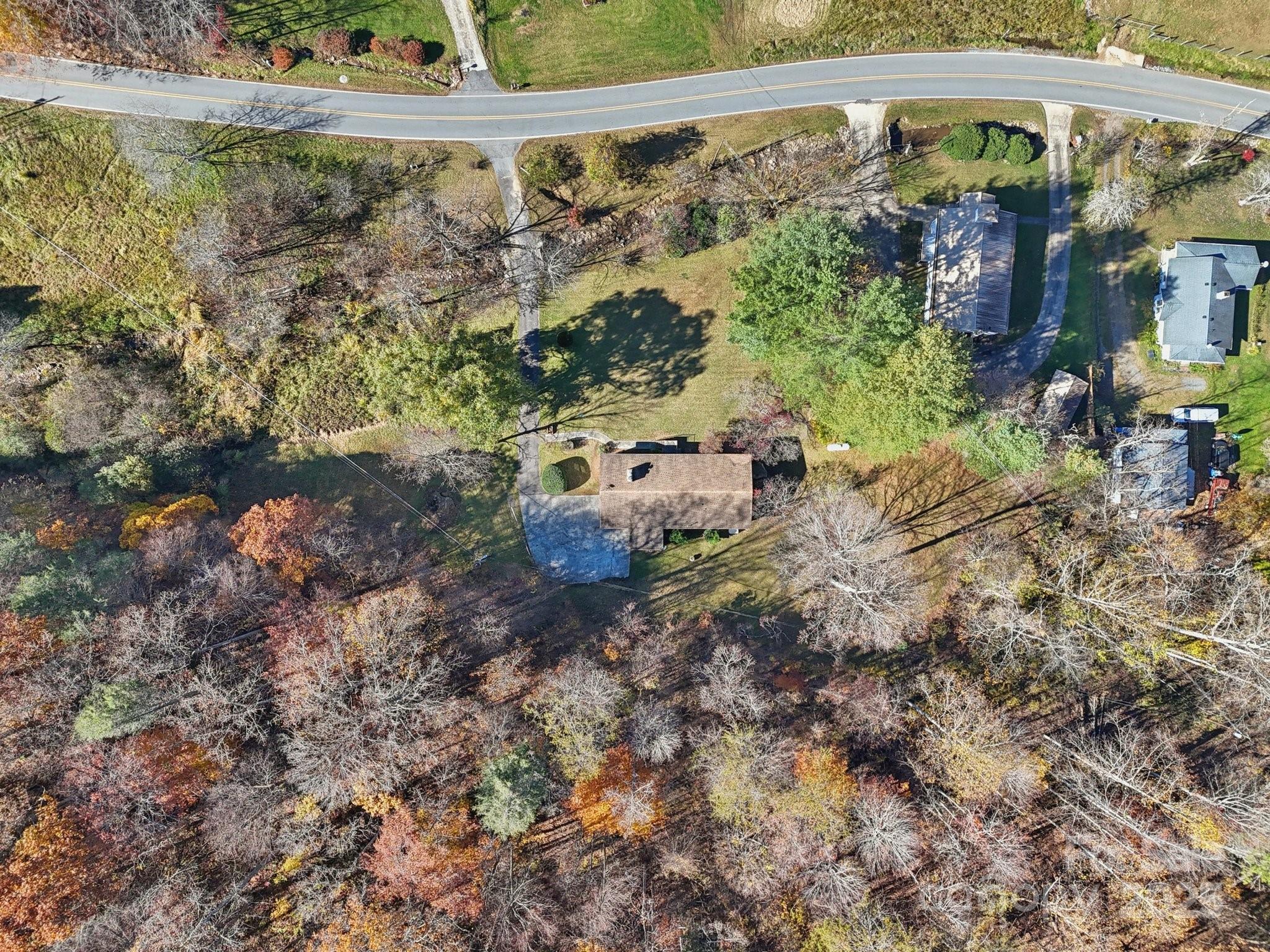 480 Paint Fork Road Barnardsville, NC 28709 - Photo 38 of 43 a backyard of a house with lots of green space