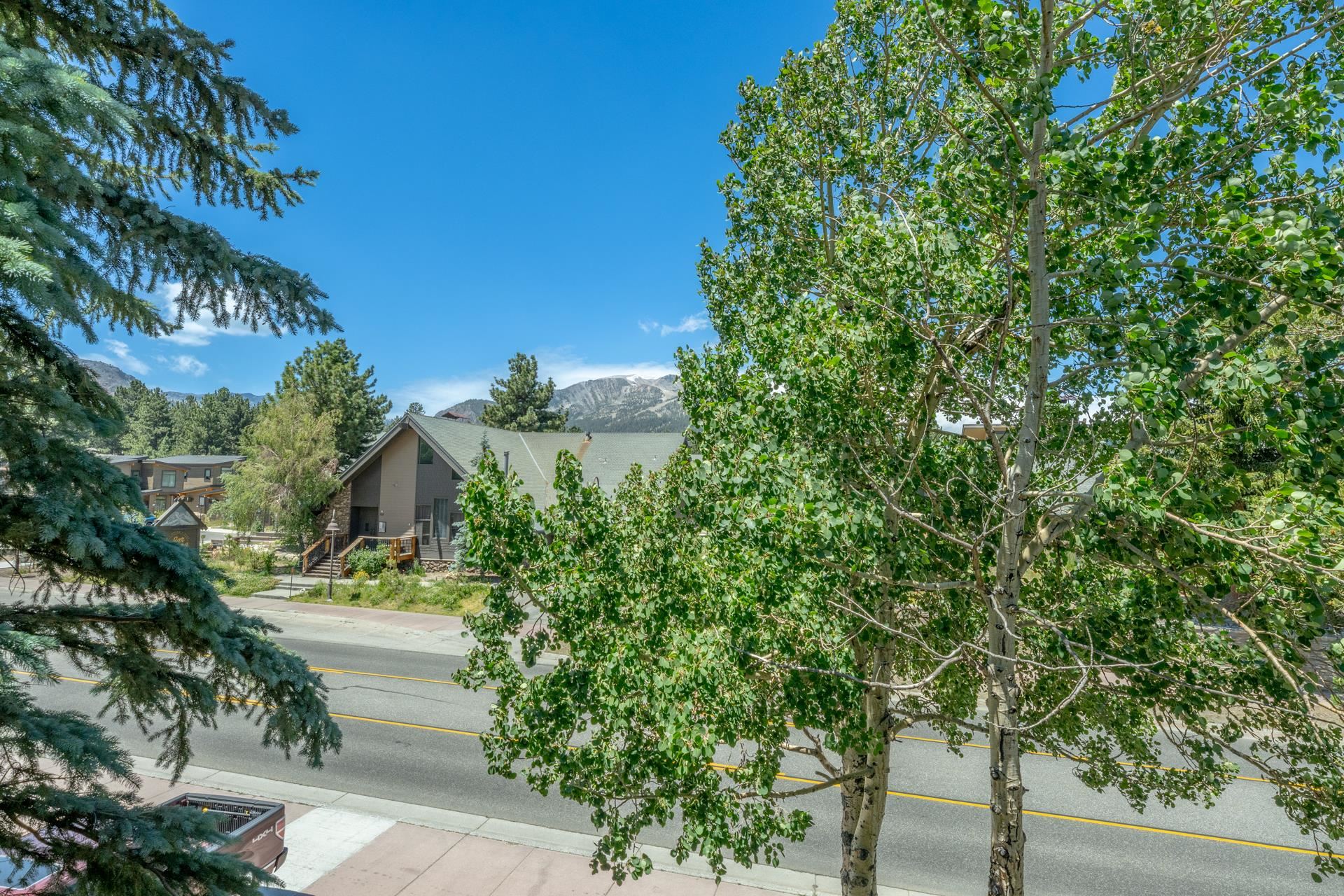 165 Old Mammoth Road, Unit 3 Mammoth Lakes, CA 93546 - Photo 37 of 48 Exterior property featuring a pitched roofline and a recessed entry