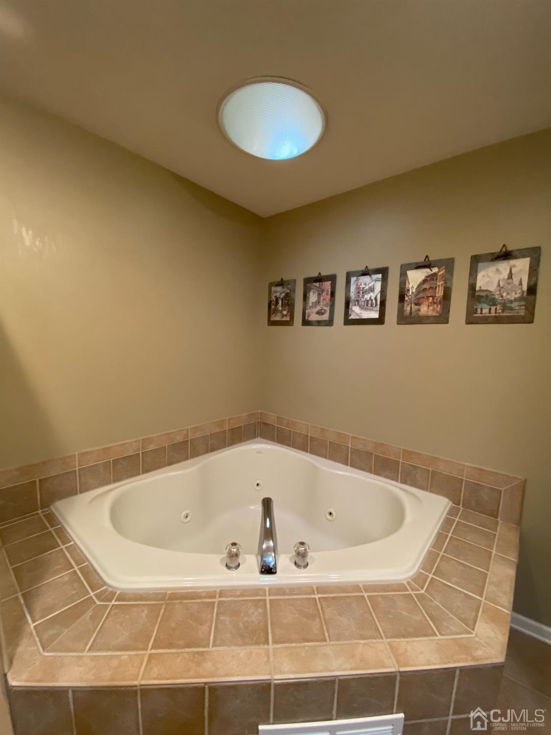 47 Heron Pointe Court Evesham, NJ 08053 - Photo 27 of 44 a white bath tub sitting in a bathroom