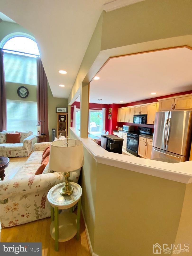47 Heron Pointe Court Evesham, NJ 08053 - Photo 6 of 44 a living room with furniture and a wooden floor