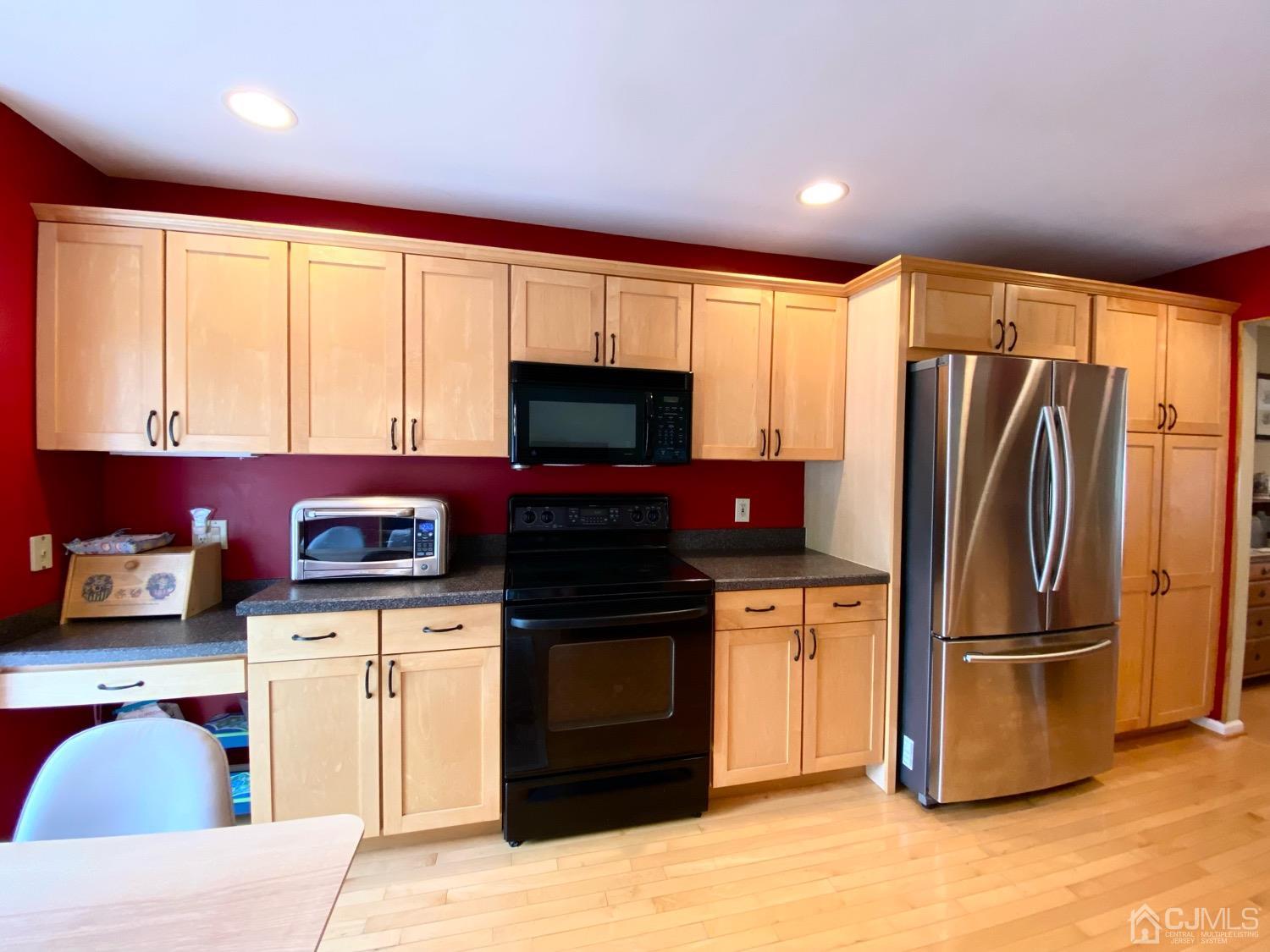47 Heron Pointe Court Evesham, NJ 08053 - Photo 9 of 44 a kitchen with stainless steel appliances granite countertop a refrigerator a stove a sink and a microwave