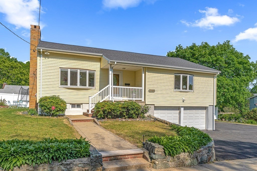 11 Main Street Winchester, MA 01890 - Photo 1 of 41 a front view of a house with garden