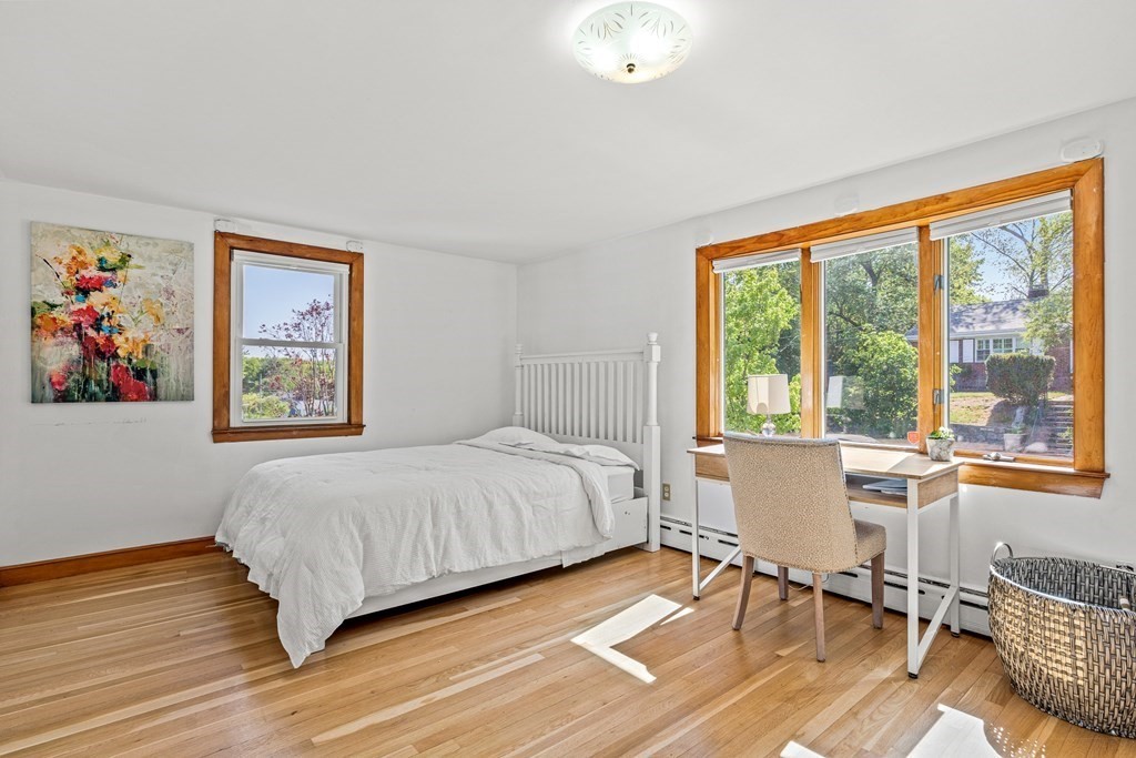 11 Main Street Winchester, MA 01890 - Photo 17 of 41 a bedroom with a bed and a large window
