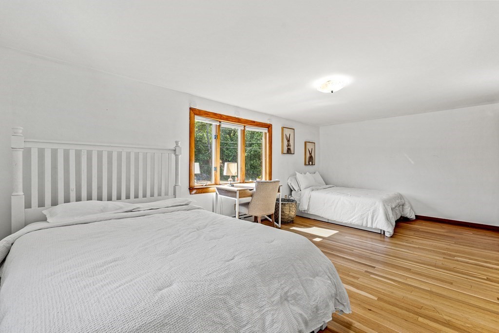 11 Main Street Winchester, MA 01890 - Photo 18 of 41 a bedroom with a bed and a large window