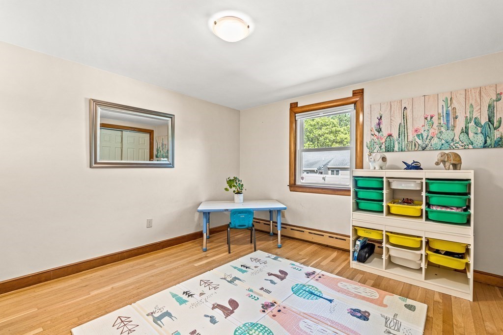 11 Main Street Winchester, MA 01890 - Photo 20 of 41 a living room with furniture and a wooden floor