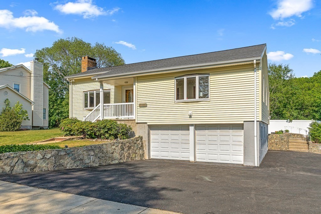 11 Main Street Winchester, MA 01890 - Photo 2 of 41 a front view of a house with a yard