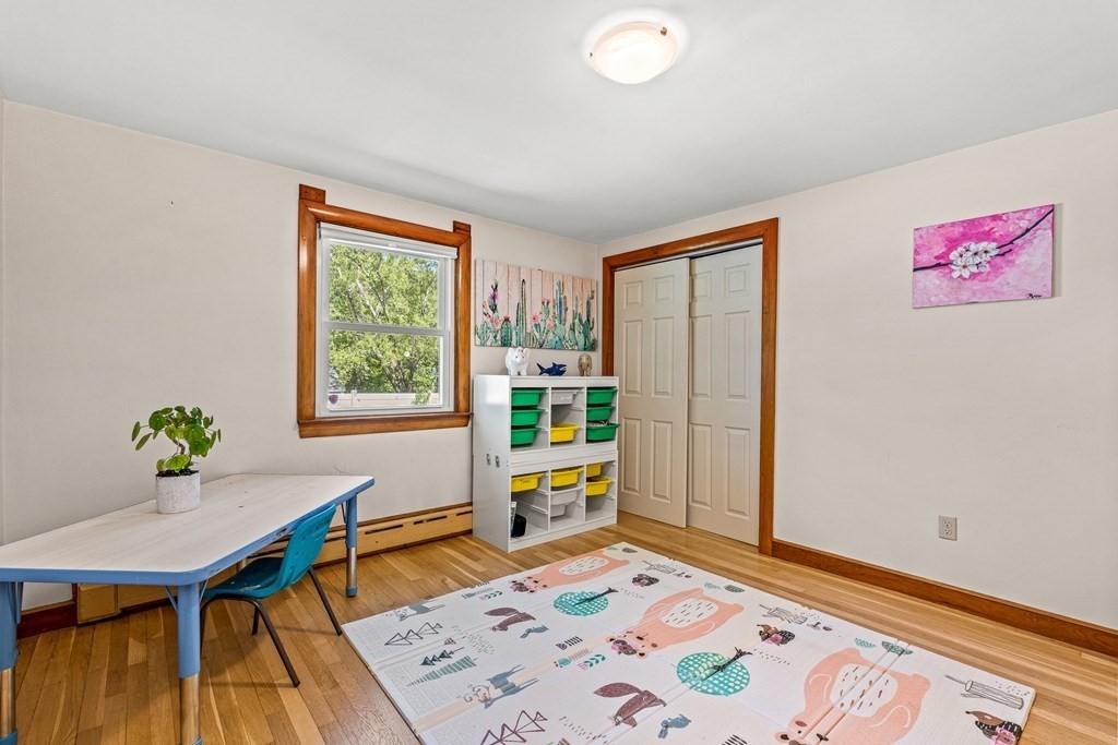 11 Main Street Winchester, MA 01890 - Photo 21 of 41 a bedroom with a bed and a table in it