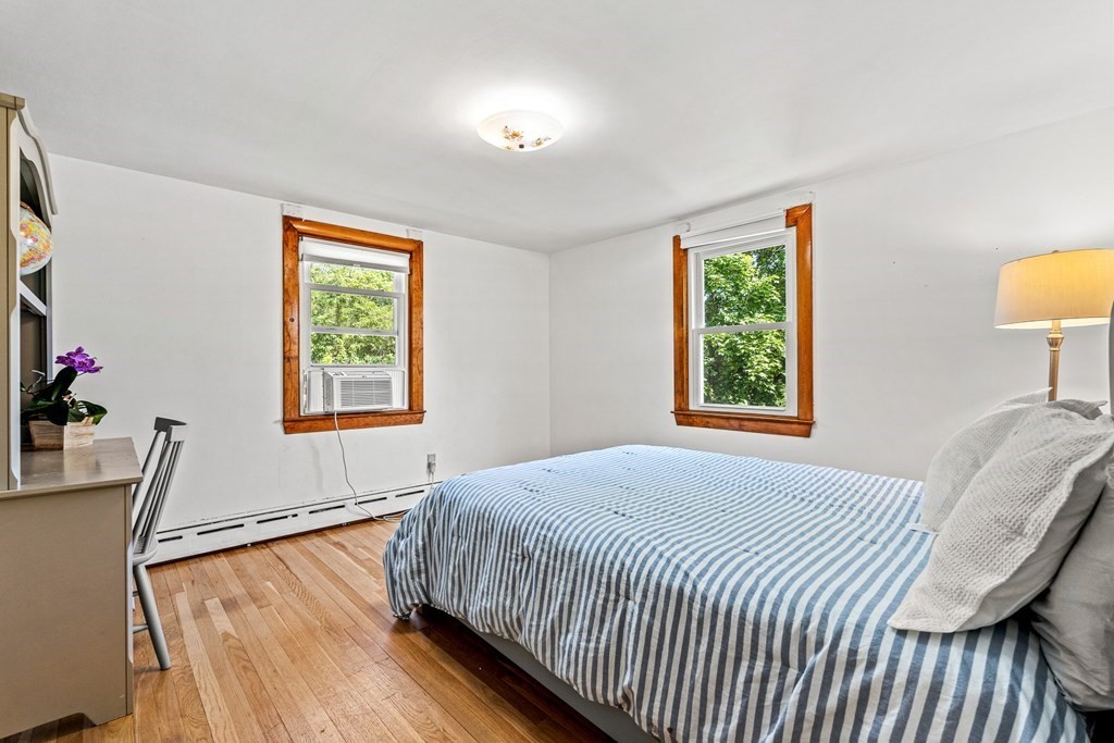 11 Main Street Winchester, MA 01890 - Photo 22 of 41 a bedroom with a bed and a window