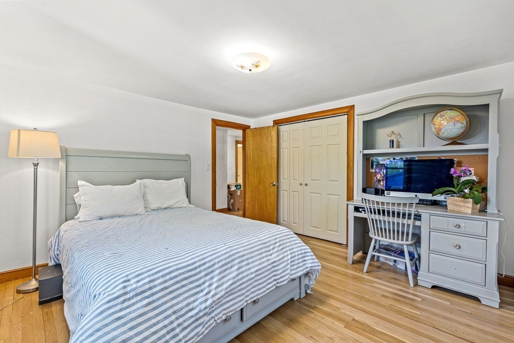 11 Main Street Winchester, MA 01890 - Photo 23 of 41 a bedroom with a bed and a flat screen tv