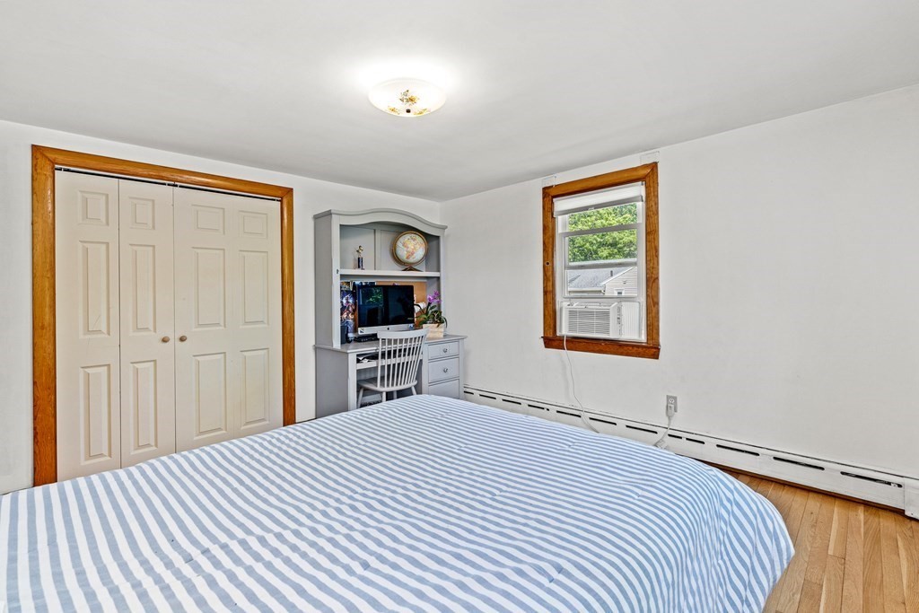 11 Main Street Winchester, MA 01890 - Photo 24 of 41 a bedroom with a bed and a window