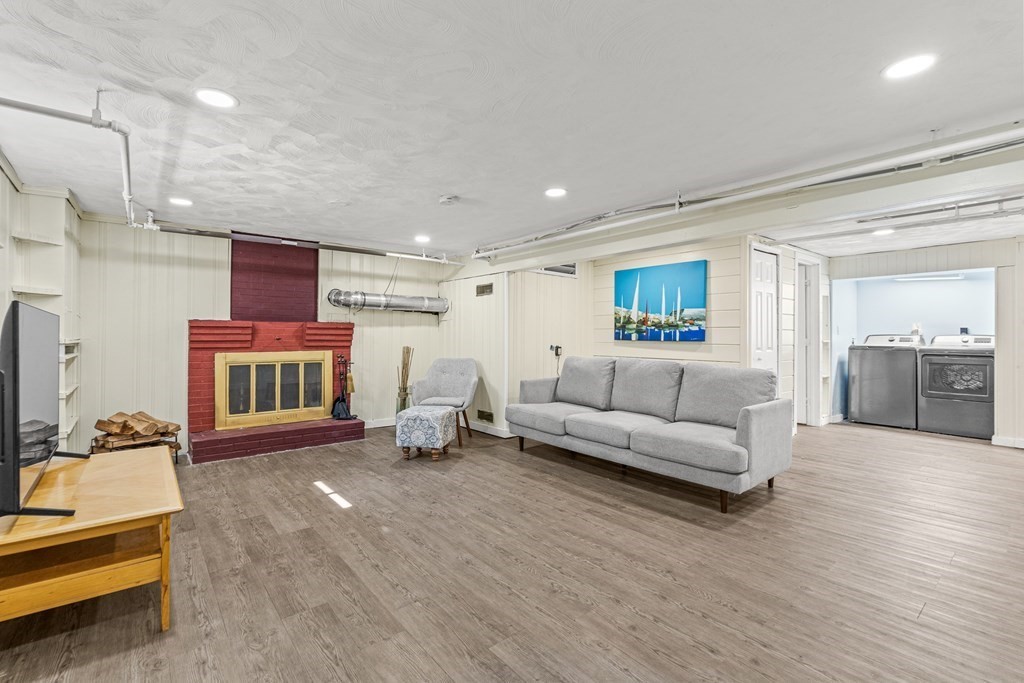 11 Main Street Winchester, MA 01890 - Photo 25 of 41 a living room with furniture and a couch