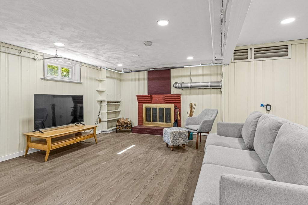 11 Main Street Winchester, MA 01890 - Photo 26 of 41 a living room with furniture and a flat screen tv
