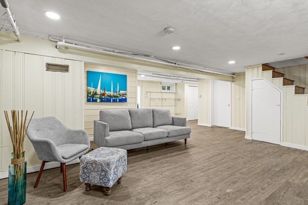 11 Main Street Winchester, MA 01890 - Photo 27 of 41 a living room with furniture and a wooden floor