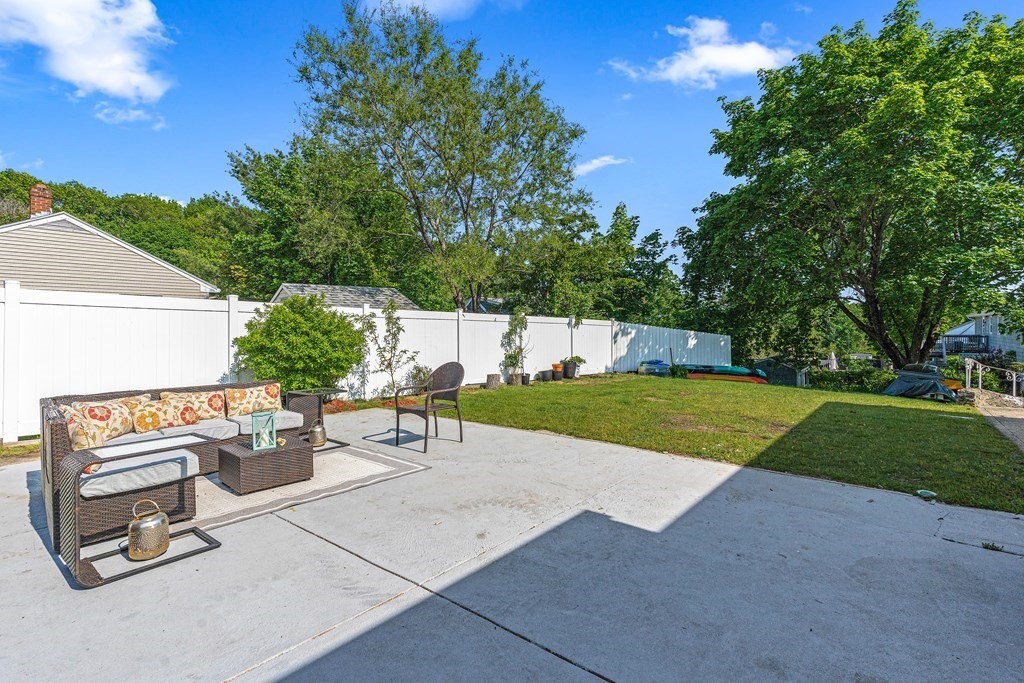 11 Main Street Winchester, MA 01890 - Photo 34 of 41 a view of a backyard with sitting area