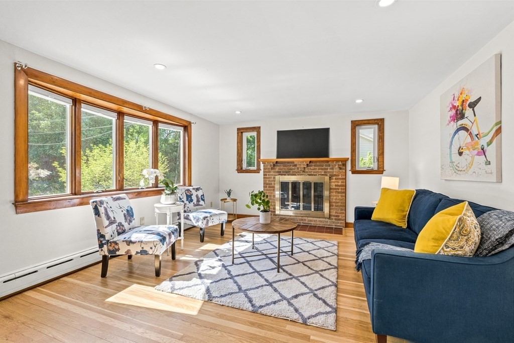 11 Main Street Winchester, MA 01890 - Photo 5 of 41 a living room with fireplace furniture and a large window