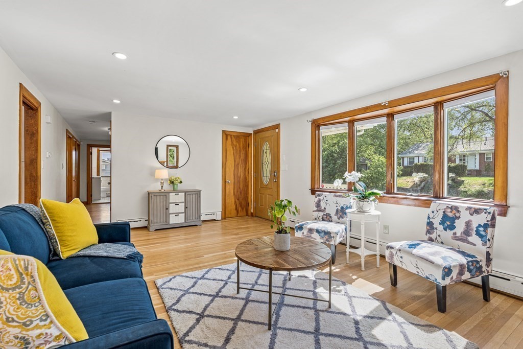 11 Main Street Winchester, MA 01890 - Photo 7 of 41 a living room with furniture and a large window