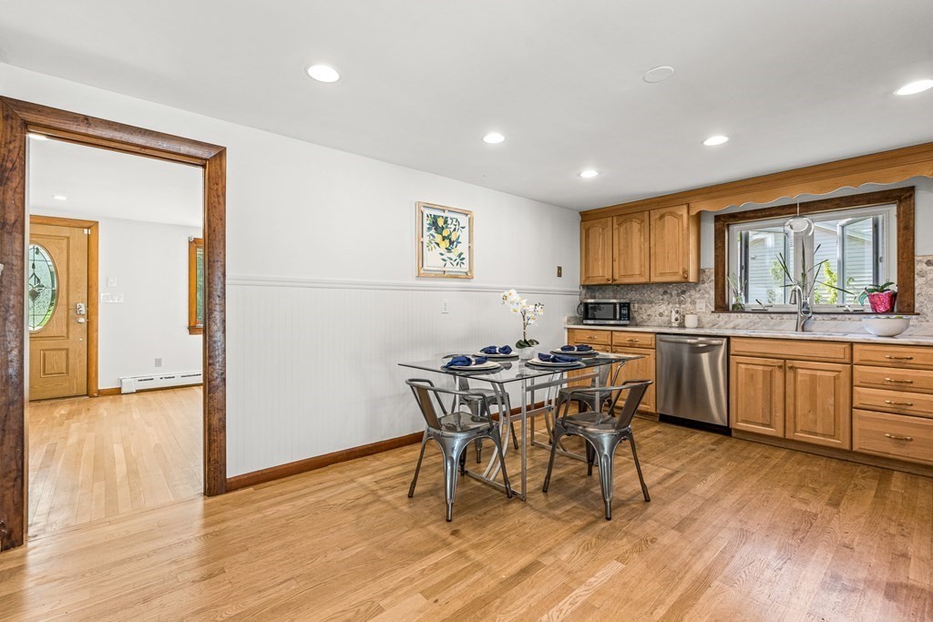 11 Main Street Winchester, MA 01890 - Photo 10 of 41 a view of a dining room with furniture and wooden floor