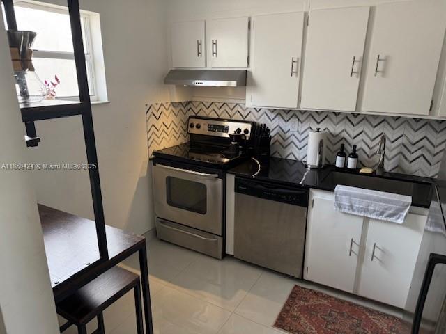1150 Collins Avenue, Unit 503 Miami Beach, FL 33139 - Photo 11 of 12 a view of kitchen stove and refrigerator