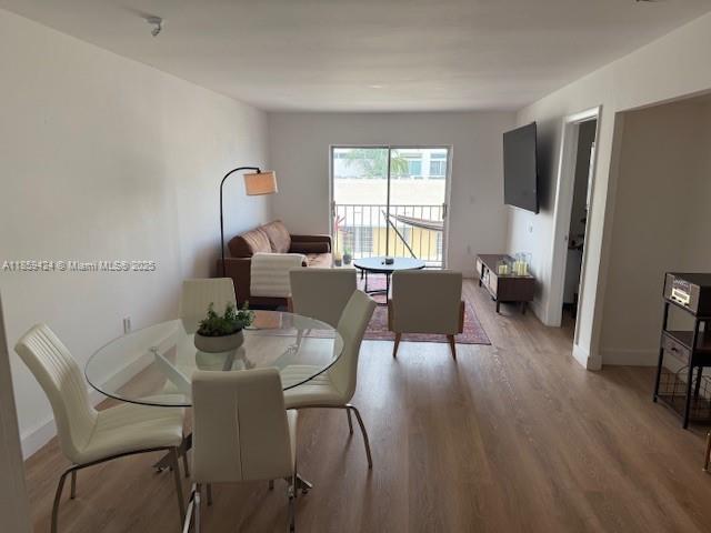 1150 Collins Avenue, Unit 503 Miami Beach, FL 33139 - Photo 4 of 12 a dining room with furniture and a window