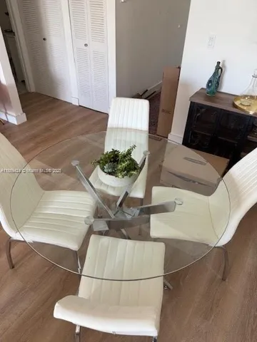 a living room with a couch and a potted plant