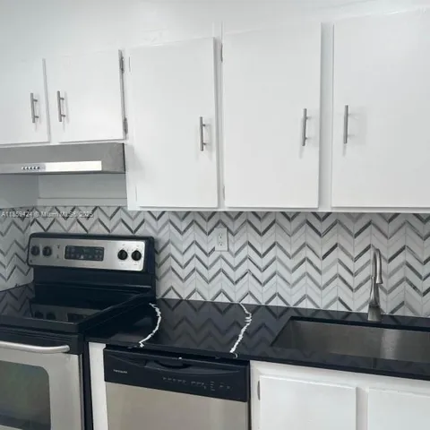 a close view of a stove and a sink