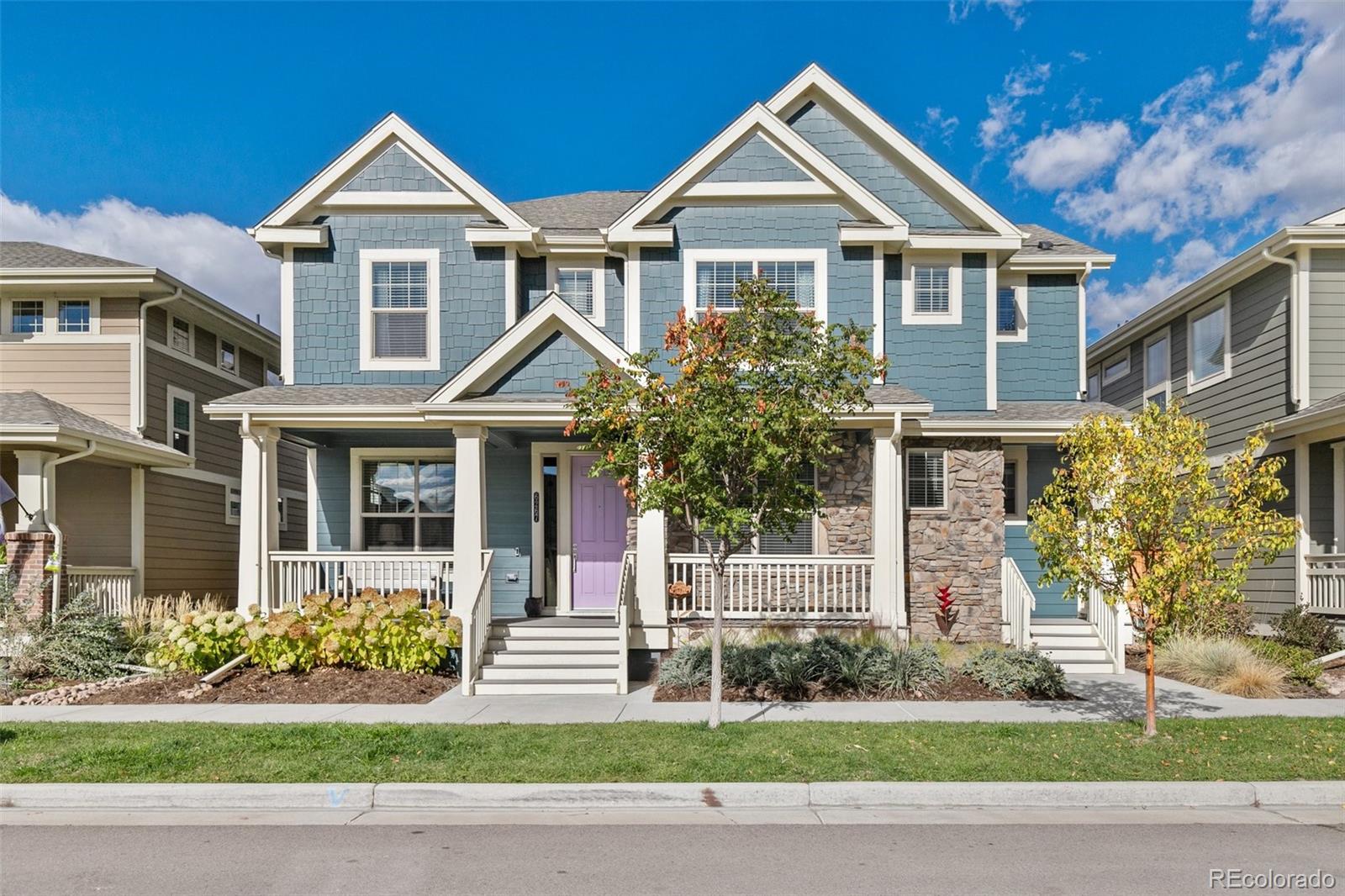 6267 North Florence Way Denver, CO 80238 - Photo 1 of 41 a front view of a house with a yard and potted plants