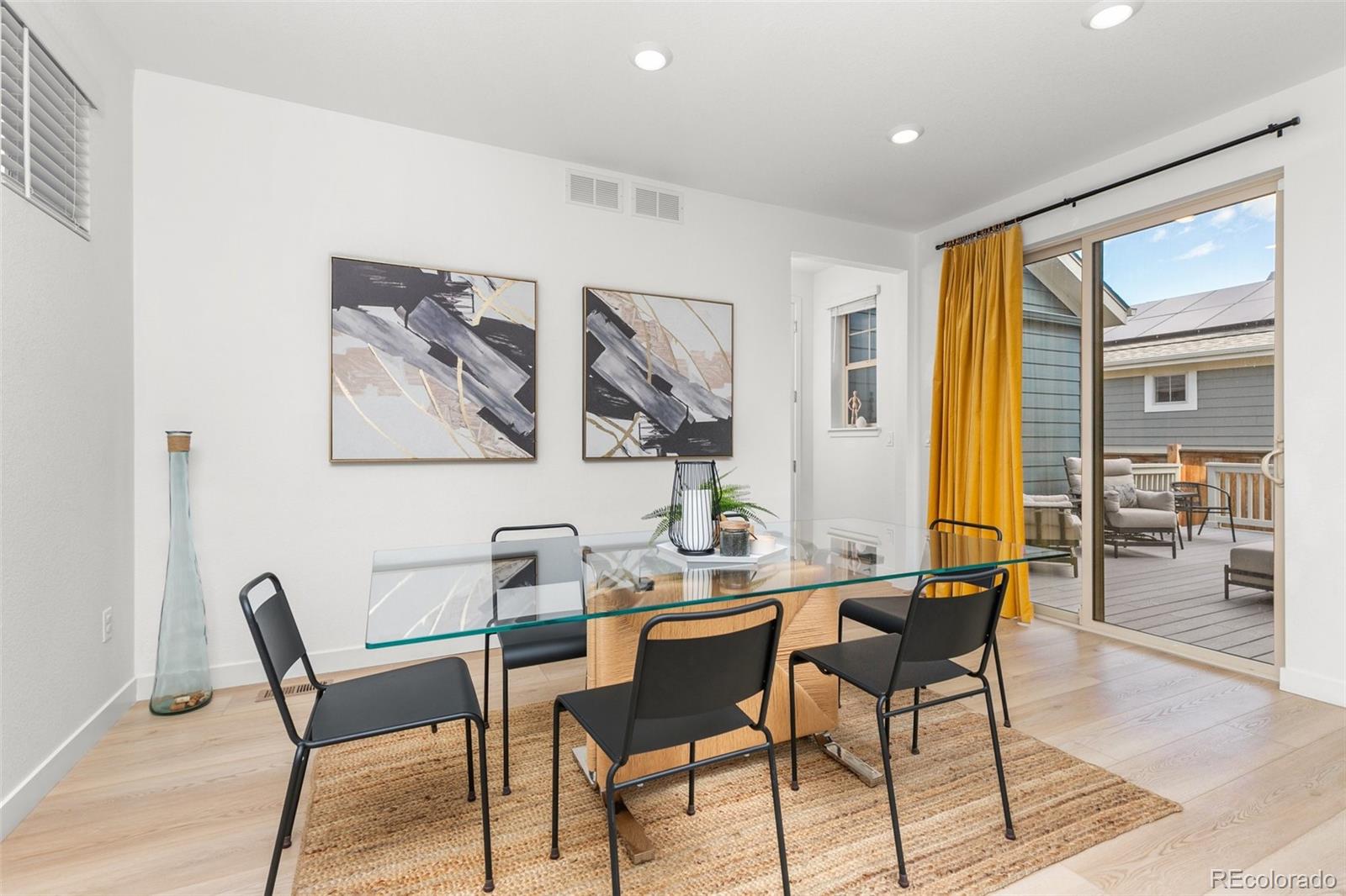 6267 North Florence Way Denver, CO 80238 - Photo 12 of 41 a view of a dining room with furniture and window