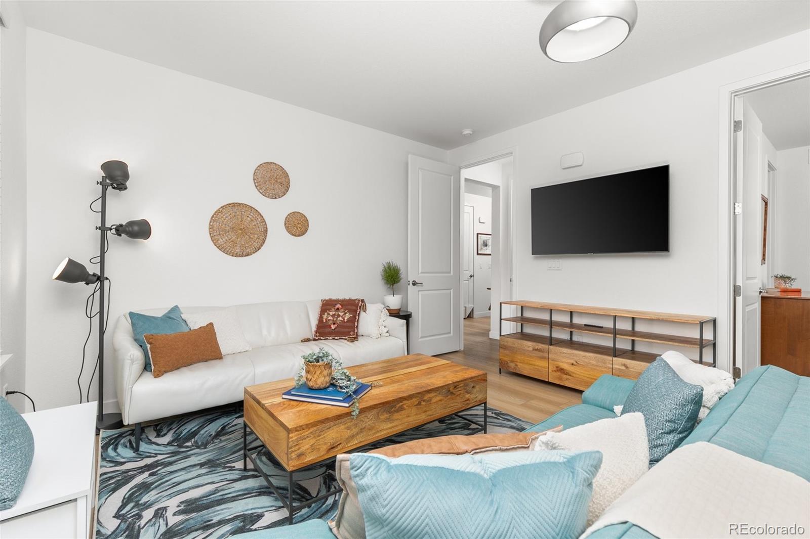 6267 North Florence Way Denver, CO 80238 - Photo 16 of 41 a living room with furniture and a flat screen tv