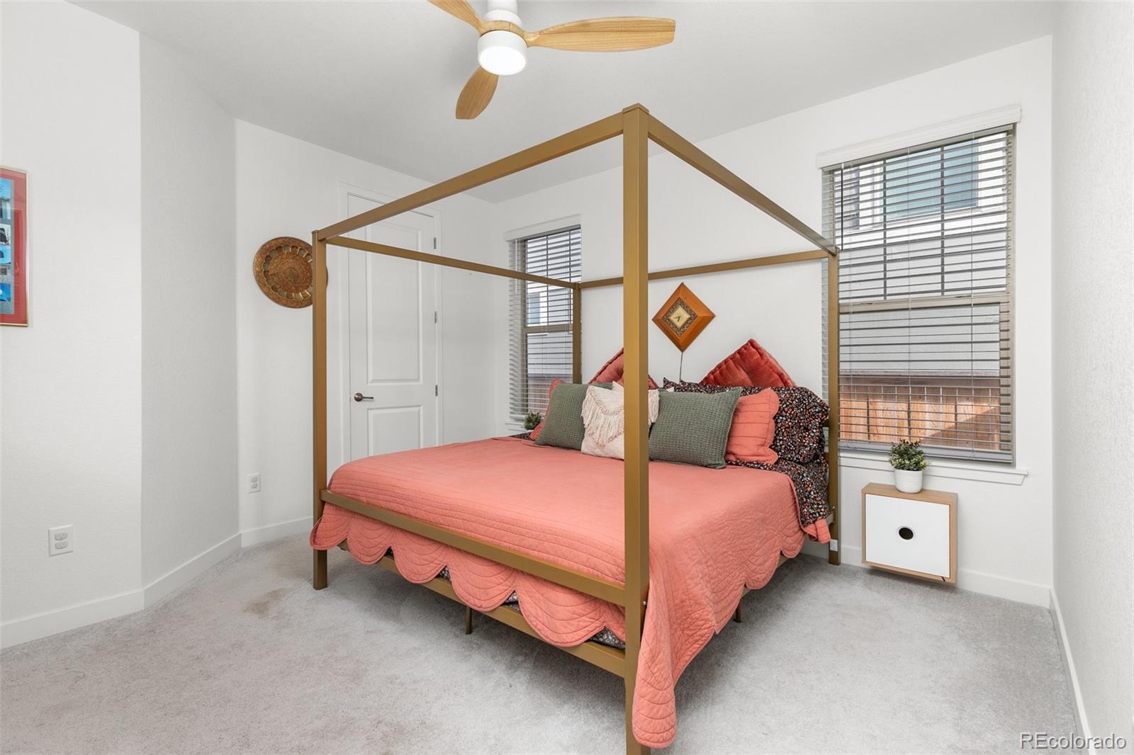 6267 North Florence Way Denver, CO 80238 - Photo 18 of 41 a bedroom with bed and a window