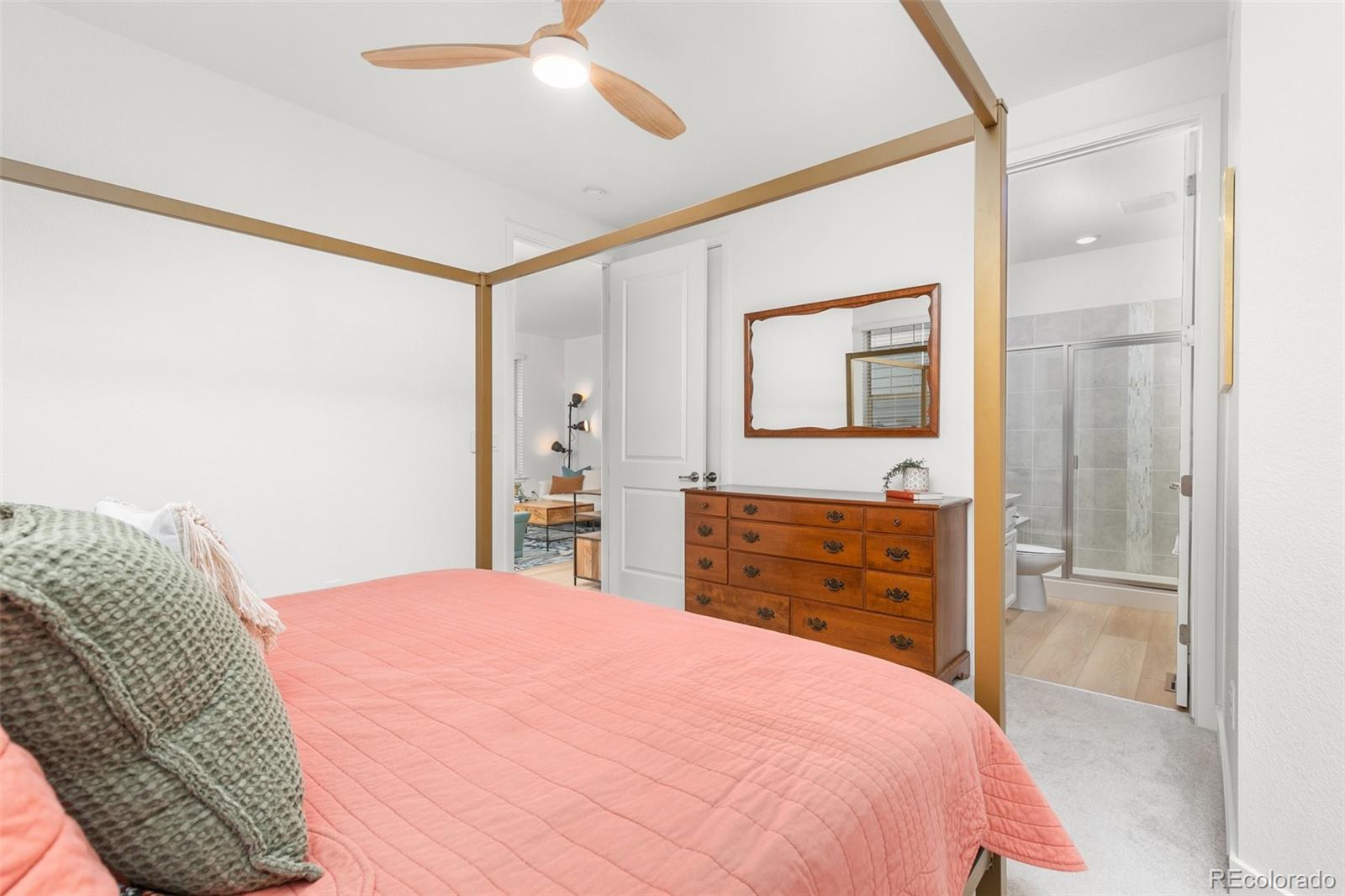 6267 North Florence Way Denver, CO 80238 - Photo 19 of 41 a bedroom with a bed and a dresser