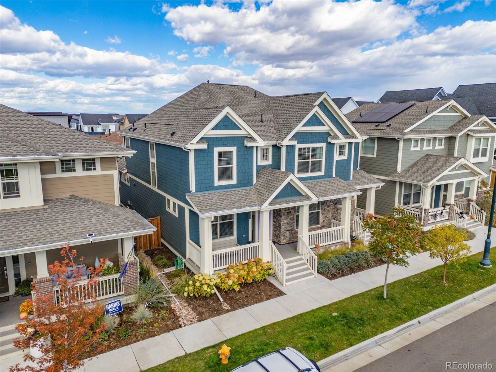 6267 North Florence Way Denver, CO 80238 - Photo 2 of 41 a front view of a house with garden