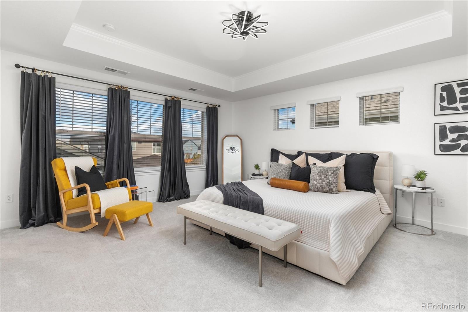 6267 North Florence Way Denver, CO 80238 - Photo 21 of 41 a bedroom with a bed and a large window