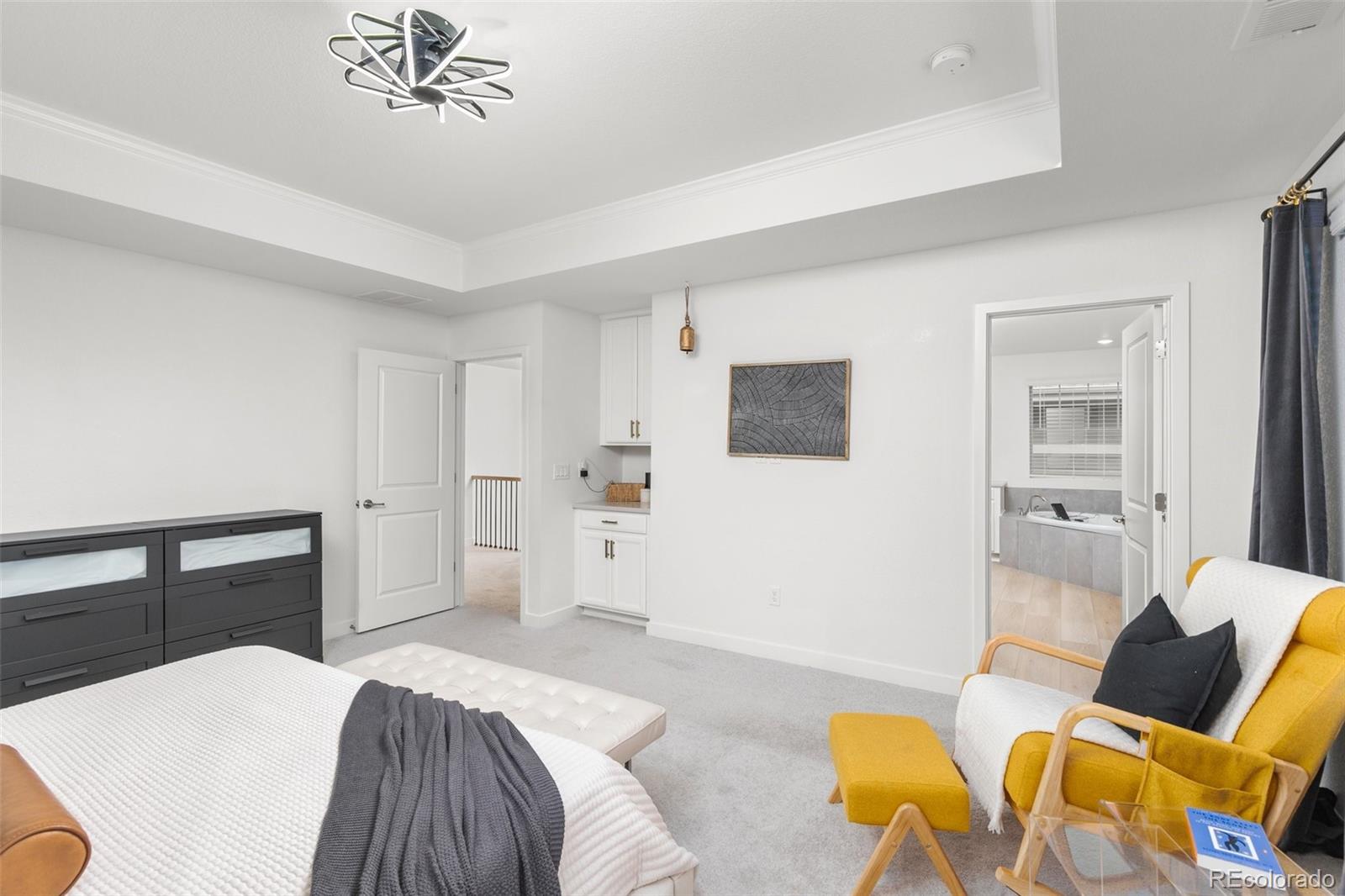 6267 North Florence Way Denver, CO 80238 - Photo 22 of 41 a bedroom with a bed and wooden floor