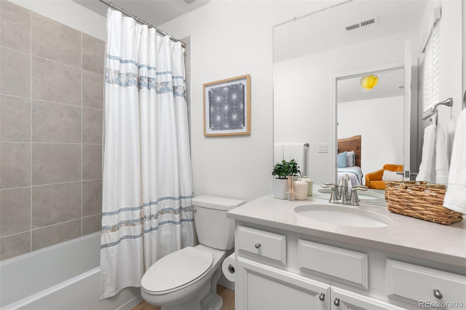 6267 North Florence Way Denver, CO 80238 - Photo 26 of 41 a bathroom with a sink a toilet and shower