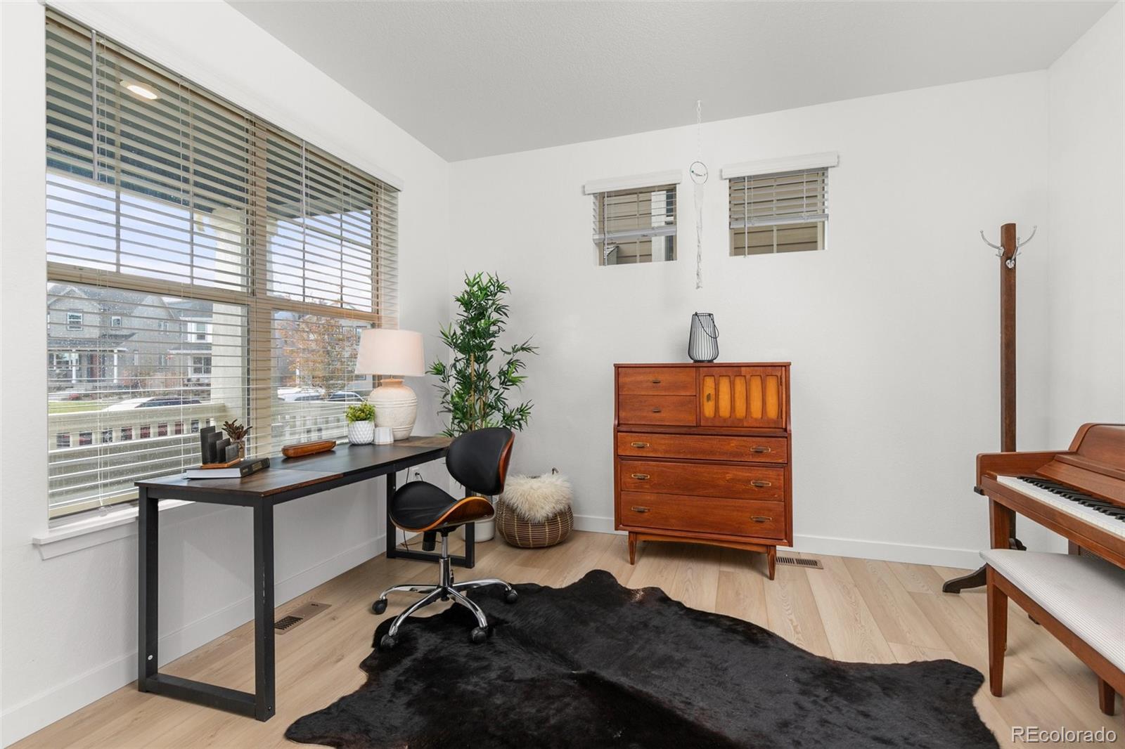 6267 North Florence Way Denver, CO 80238 - Photo 6 of 41 a view of a workspace with furniture and a window