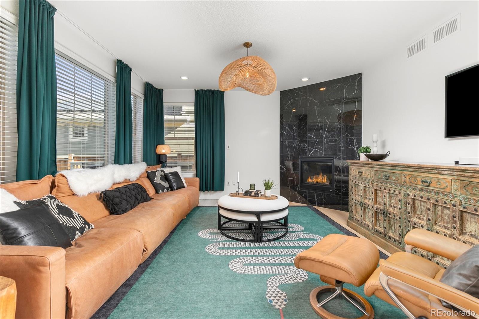 6267 North Florence Way Denver, CO 80238 - Photo 7 of 41 a living room with furniture and a flat screen tv