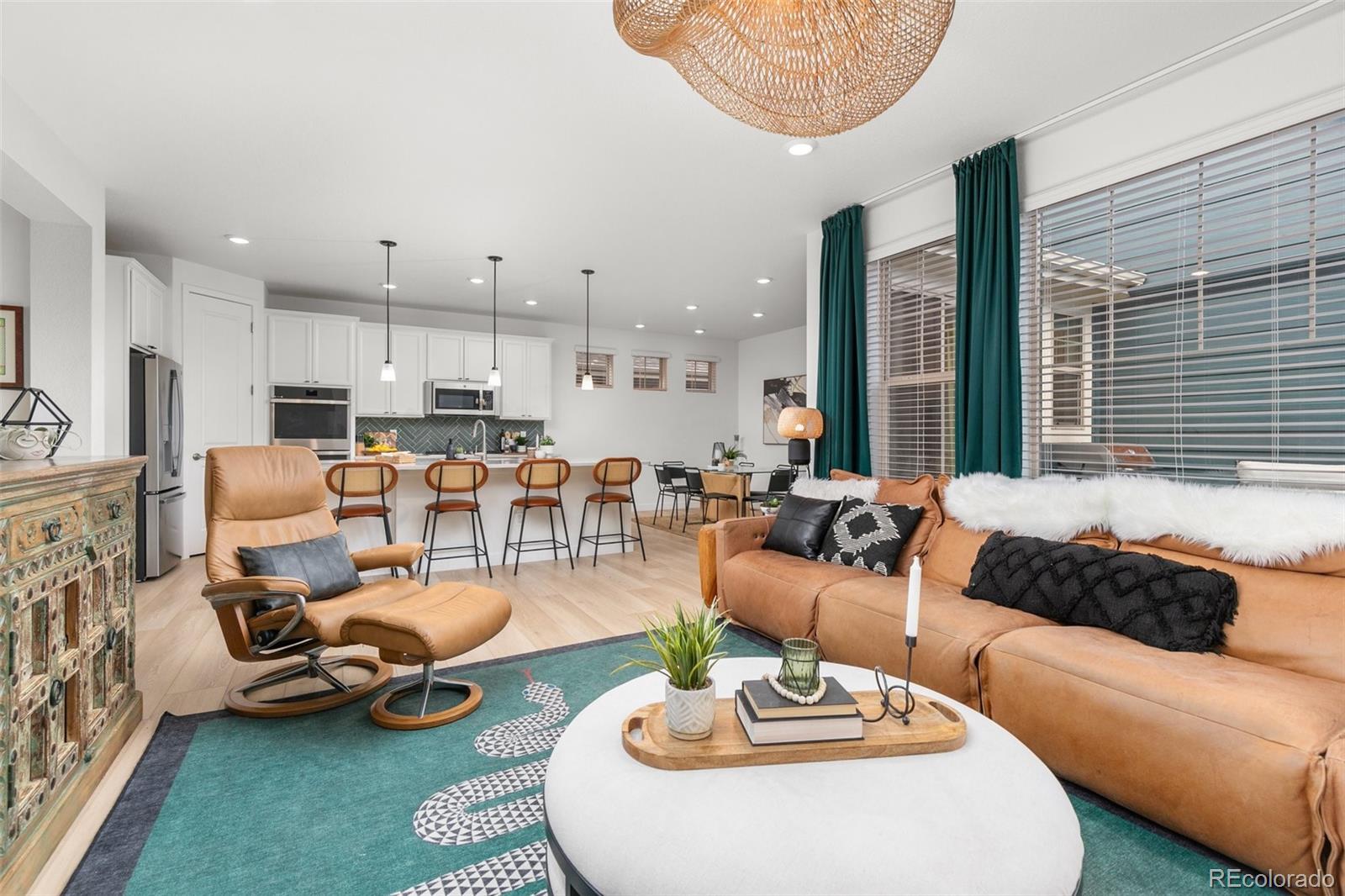 6267 North Florence Way Denver, CO 80238 - Photo 8 of 41 a living room with furniture kitchen view and a large window