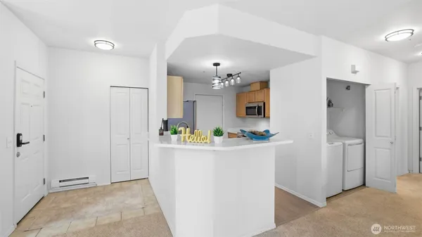 a kitchen view with stainless steel appliances a refrigerator and a refrigerator