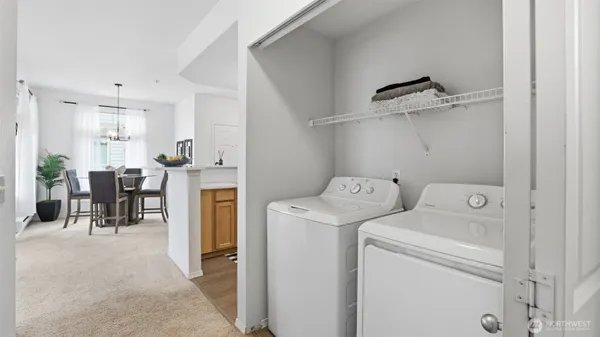 a view of storage and utility room with washer and dryer