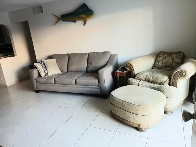 a living room with furniture and a couch