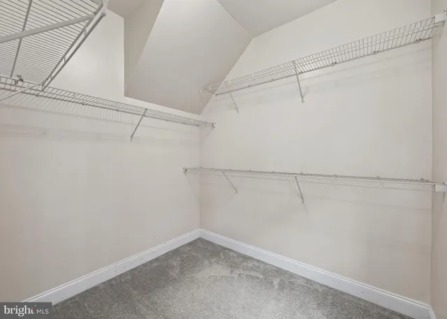 a bathroom with a tub a double vanity sink and a mirror