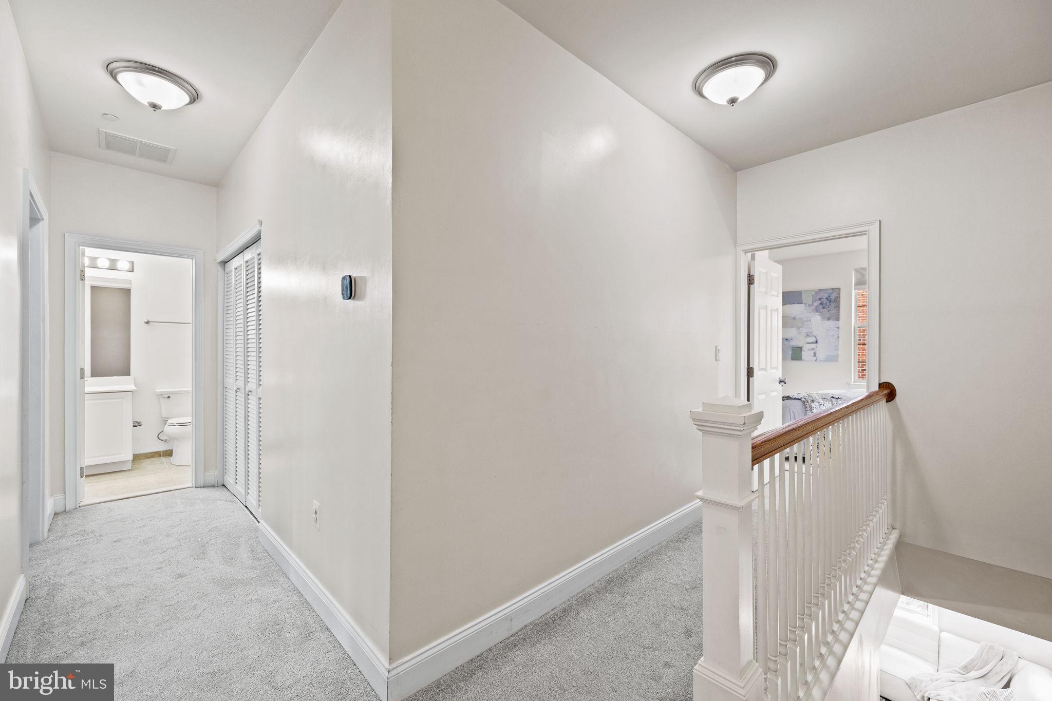 201 Commodore Court Philadelphia, PA 19146 - Photo 37 of 61 a view of a hallway with wooden floor and entryway